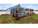 Large backyard with a screened-in pool and patio at 6019 Live Oak Dr, Winter Haven, FL 33880