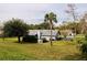 Private backyard with lush landscaping and large trees at 653 Pelican Bay Dr, Daytona Beach, FL 32119