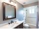 Bathroom with a bathtub, shower, and updated vanity at 653 Pelican Bay Dr, Daytona Beach, FL 32119