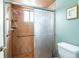 Walk-in shower with tiled walls and safety features at 653 Pelican Bay Dr, Daytona Beach, FL 32119
