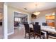 Dining room with a large table and view into the living room at 653 Pelican Bay Dr, Daytona Beach, FL 32119
