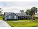Charming ranch home with gray exterior and landscaped yard at 653 Pelican Bay Dr, Daytona Beach, FL 32119
