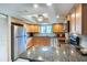 Modern kitchen with stainless steel appliances and granite countertops at 653 Pelican Bay Dr, Daytona Beach, FL 32119