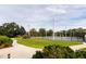 Community tennis courts with a gazebo and manicured lawn at 653 Pelican Bay Dr, Daytona Beach, FL 32119