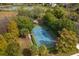 Community tennis courts nestled in a wooded area at 6893 Hidden Glade Pl, Sanford, FL 32771
