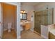 Bathroom with shower, toilet, vanity, and neutral tile floors at 6893 Hidden Glade Pl, Sanford, FL 32771
