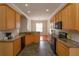 Bright kitchen featuring wood cabinets, granite counters, and a breakfast nook at 6893 Hidden Glade Pl, Sanford, FL 32771