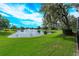 Beautiful lake view with lush landscaping at 6893 Hidden Glade Pl, Sanford, FL 32771