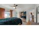Spacious bedroom with mirrored closet doors and access to another room at 131 Mitchell Pl, Daytona Beach, FL 32118