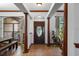 Inviting entryway with decorative columns and tiled floors at 1562 Anorada Blvd, Kissimmee, FL 34744