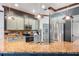 Spacious kitchen featuring granite countertops, stainless steel appliances, and custom cabinetry at 1562 Anorada Blvd, Kissimmee, FL 34744
