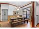 Farmhouse style dining room with wood table and bench seating at 1562 Anorada Blvd, Kissimmee, FL 34744