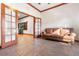 Sunlit office features tiled floors and a brown leather couch at 1562 Anorada Blvd, Kissimmee, FL 34744