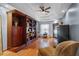 Spacious library with built-in wooden shelving and hardwood floors at 1562 Anorada Blvd, Kissimmee, FL 34744