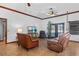 Comfortable living room with leather furniture and large screen TV at 1562 Anorada Blvd, Kissimmee, FL 34744