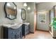 Bathroom with and sinks and tiled floors at 1562 Anorada Blvd, Kissimmee, FL 34744