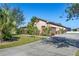 House exterior with driveway and garage at 1562 Anorada Blvd, Kissimmee, FL 34744