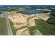 Aerial view of community featuring lake and new homes under construction at 16862 Muskgrass Dr, Winter Garden, FL 34787