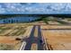 Aerial view of new community development near a lake at 16862 Muskgrass Dr, Winter Garden, FL 34787