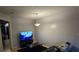 Cozy living room featuring a large TV and comfortable seating at 2546 Lemon Tree Ln # 4, Orlando, FL 32839
