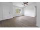 Spacious living room featuring wood-look floors and a large window at 2670 Bentley Dr, Deltona, FL 32738
