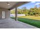 Covered patio overlooking a fenced backyard at 3211 Eagle Watch Dr, Kissimmee, FL 34746