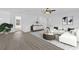 Upstairs living area with white sectional sofa and wood-look flooring at 3211 Eagle Watch Dr, Kissimmee, FL 34746