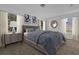 Main bedroom with a plush bed, dresser, and large mirror at 3211 Eagle Watch Dr, Kissimmee, FL 34746