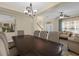 Spacious dining room features a large table and access to the living room at 1161 Cathcart Cir, Sanford, FL 32771