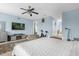 Spacious Primary bedroom with a king-size bed and large TV at 1161 Cathcart Cir, Sanford, FL 32771