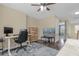 Home office or bedroom with a desk, TV, and ample floor space at 1161 Cathcart Cir, Sanford, FL 32771