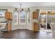 Kitchen features bay window, wood cabinets and access to patio at 1161 Cathcart Cir, Sanford, FL 32771
