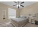 Bedroom with a queen bed, ceiling fan, and window coverings at 1161 Cathcart Cir, Sanford, FL 32771