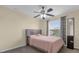 Bright bedroom with a queen-size bed and plenty of closet space at 1161 Cathcart Cir, Sanford, FL 32771
