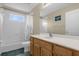 Clean bathroom with a shower, bathtub, and double vanity at 1161 Cathcart Cir, Sanford, FL 32771