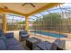 Inviting pool area with covered patio and seating at 1161 Cathcart Cir, Sanford, FL 32771