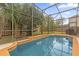 Refreshing screened-in pool with tiled coping at 1161 Cathcart Cir, Sanford, FL 32771