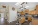 Bright kitchen with wood cabinets, stainless steel appliances, and an island at 1161 Cathcart Cir, Sanford, FL 32771