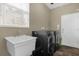 Laundry room with a utility sink and space for washer and dryer at 1161 Cathcart Cir, Sanford, FL 32771