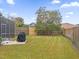 Landscaped backyard with grill and fenced area at 1161 Cathcart Cir, Sanford, FL 32771