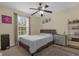 Bedroom with a full bed, ceiling fan, and window coverings at 1161 Cathcart Cir, Sanford, FL 32771