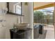 Modern bathroom with a vessel sink and view of the pool area at 1161 Cathcart Cir, Sanford, FL 32771