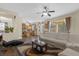 Open concept living room with kitchen views and access to patio at 1161 Cathcart Cir, Sanford, FL 32771