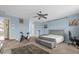 Spacious Primary bedroom with a king-size bed and sitting area at 1161 Cathcart Cir, Sanford, FL 32771