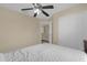 Bedroom with a queen bed, ceiling fan, and double door closet at 1161 Cathcart Cir, Sanford, FL 32771