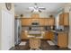 Spacious kitchen with wood cabinets, stainless steel appliances, and an island at 1161 Cathcart Cir, Sanford, FL 32771