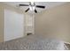 Bedroom with a queen bed, ceiling fan, and double door closet at 1161 Cathcart Cir, Sanford, FL 32771