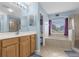 Large bathroom with a double vanity, soaking tub, and walk-in shower at 1161 Cathcart Cir, Sanford, FL 32771