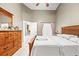 Main bedroom with wood furniture and ceiling fan at 12105 Harkness Ct, Orlando, FL 32828