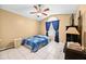 Bright bedroom with a bed and large window at 12105 Harkness Ct, Orlando, FL 32828